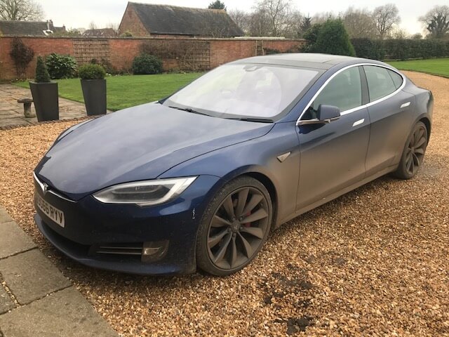 A dirty Tesla ready for cleaning